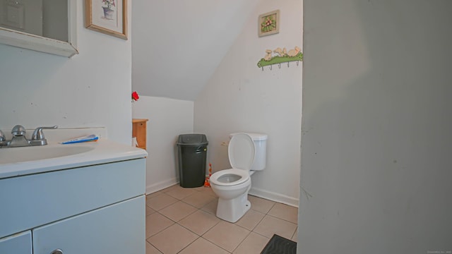1149 Central Ave, Bridgeport, CT 06607 - bathroom with toilet, vanity, tile patterned flooring, and vaulted ceiling