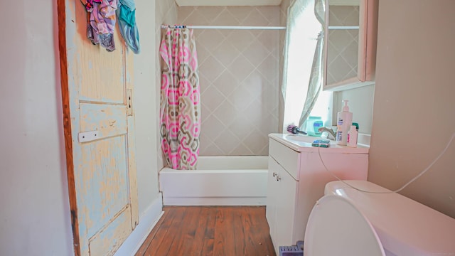 1149 Central Ave, Bridgeport, CT 06607 - full bathroom with vanity, toilet, wood finished floors, and shower / bath combination with curtain