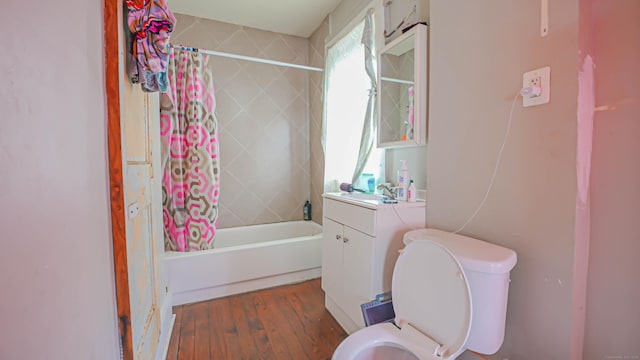 1149 Central Ave, Bridgeport, CT 06607 - full bath featuring toilet, vanity, shower / bathtub combination with curtain, and wood finished floors