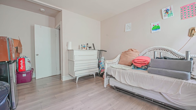 1149 Central Ave, Bridgeport, CT 06607 - bedroom with wood finished floors and freestanding refrigerator