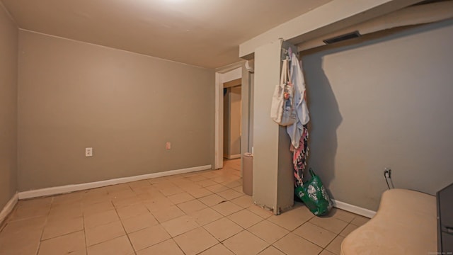 1149 Central Ave, Bridgeport, CT 06607 - empty room featuring light tile patterned floors and baseboards