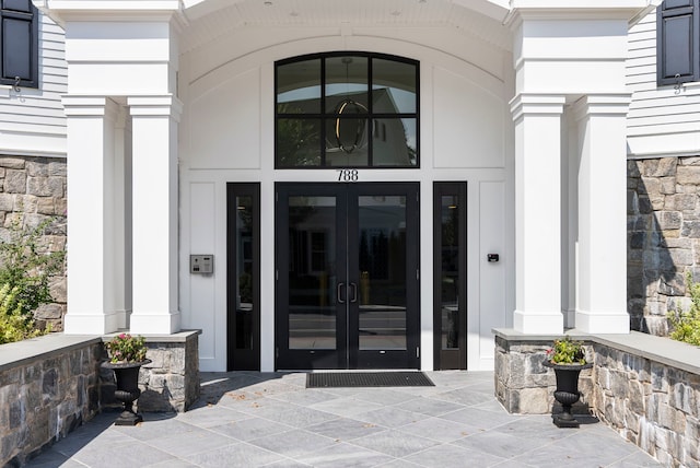 788 Farmington Ave Apt 202, Farmington, CT 06032 - view of exterior entry featuring french doors and stone siding