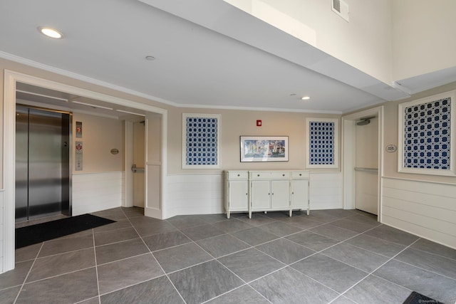 788 Farmington Ave Apt 202, Farmington, CT 06032 - empty room with elevator, ornamental molding, dark tile patterned flooring, recessed lighting, and a wainscoted wall