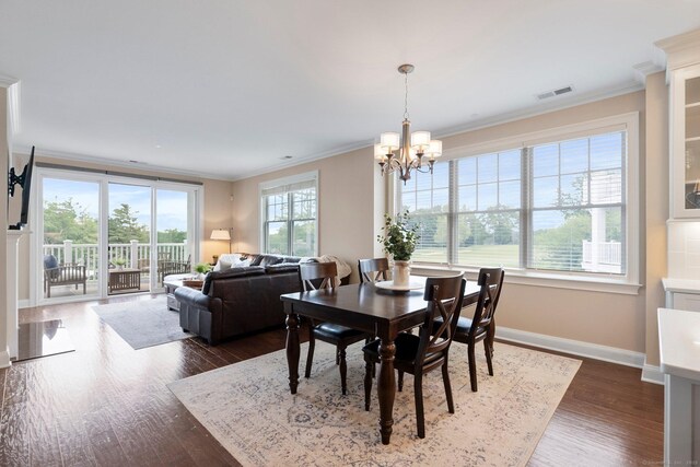 788 Farmington Ave Apt 202, Farmington, CT 06032 - dining space with a chandelier, dark wood-style flooring, crown molding, and baseboards