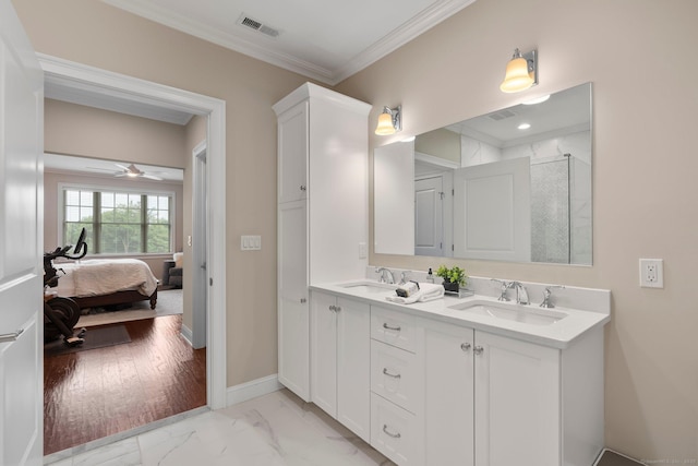 788 Farmington Ave Apt 202, Farmington, CT 06032 - full bath featuring marble look tile flooring, double vanity, ornamental molding, ensuite bathroom, and baseboards