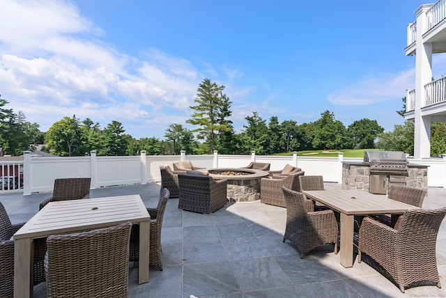788 Farmington Ave Apt 202, Farmington, CT 06032 - view of patio / terrace with outdoor dining space, view of wooded area, and an outdoor living space with a fire pit