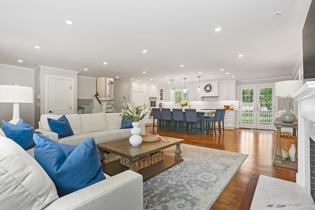 25 Conrad Rd, New Canaan, CT 06840 - living area with crown molding, recessed lighting, stairs, and wood finished floors