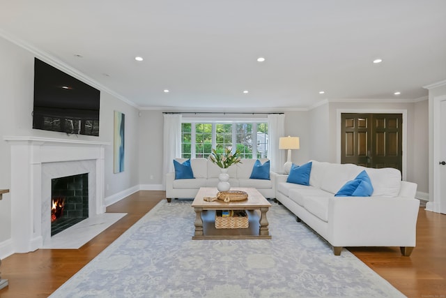 25 Conrad Rd, New Canaan, CT 06840 - living room featuring wood finished floors, recessed lighting, a high end fireplace, baseboards, and crown molding