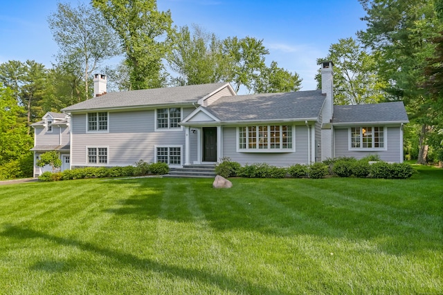 25 Conrad Rd, New Canaan, CT 06840 - split level home with a chimney, a front lawn, and a shingled roof