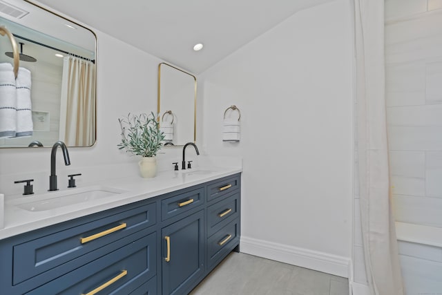 25 Conrad Rd, New Canaan, CT 06840 - full bathroom featuring double vanity, baseboards, curtained shower, and tile patterned floors