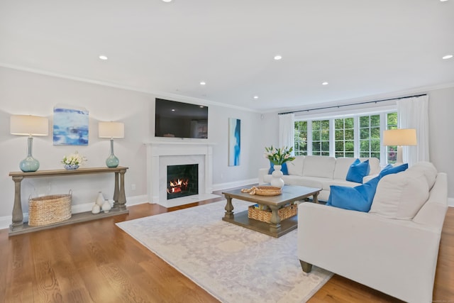 25 Conrad Rd, New Canaan, CT 06840 - living room featuring ornamental molding, a fireplace with flush hearth, wood finished floors, recessed lighting, and baseboards