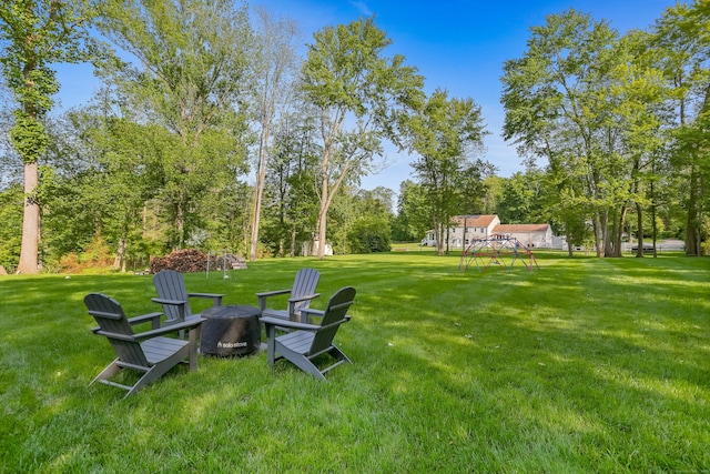 25 Conrad Rd, New Canaan, CT 06840 - view of grassy yard featuring an outdoor fire pit
