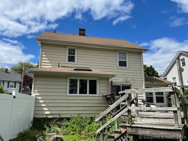 79 Van St, Stratford, CT 06614 - rear view of property featuring a chimney and a deck