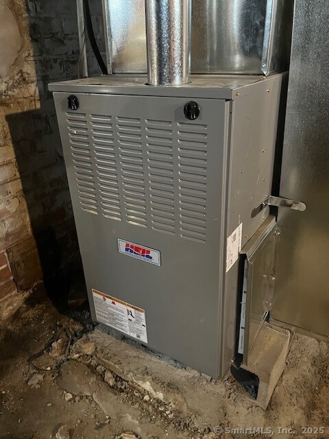 79 Van St, Stratford, CT 06614 - utility room featuring heating unit