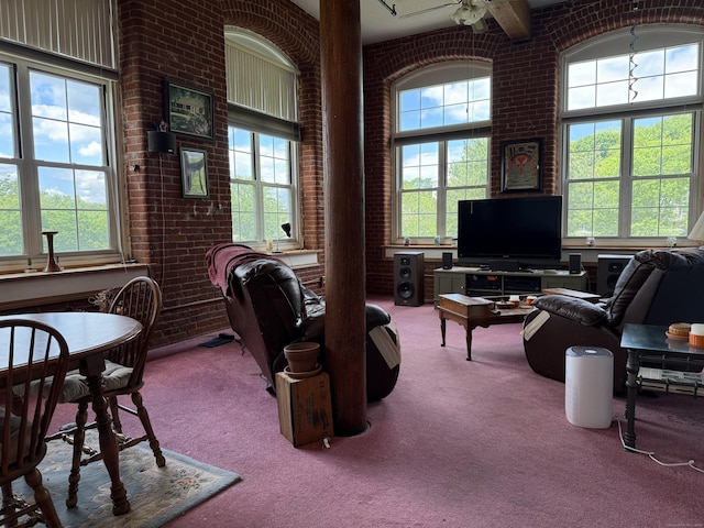 45 Main St Apt 401, Plainfield, CT 06374 - living room with carpet floors, healthy amount of natural light, and brick wall