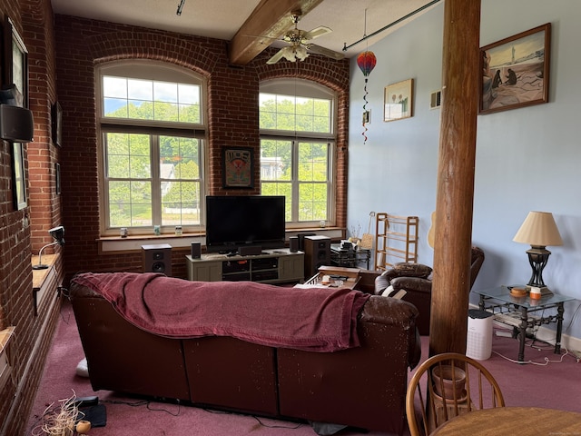 45 Main St Apt 401, Plainfield, CT 06374 - living room featuring carpet flooring, brick wall, ceiling fan, and beamed ceiling