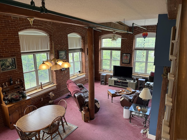 45 Main St Apt 401, Plainfield, CT 06374 - carpeted living area featuring brick wall and a textured ceiling
