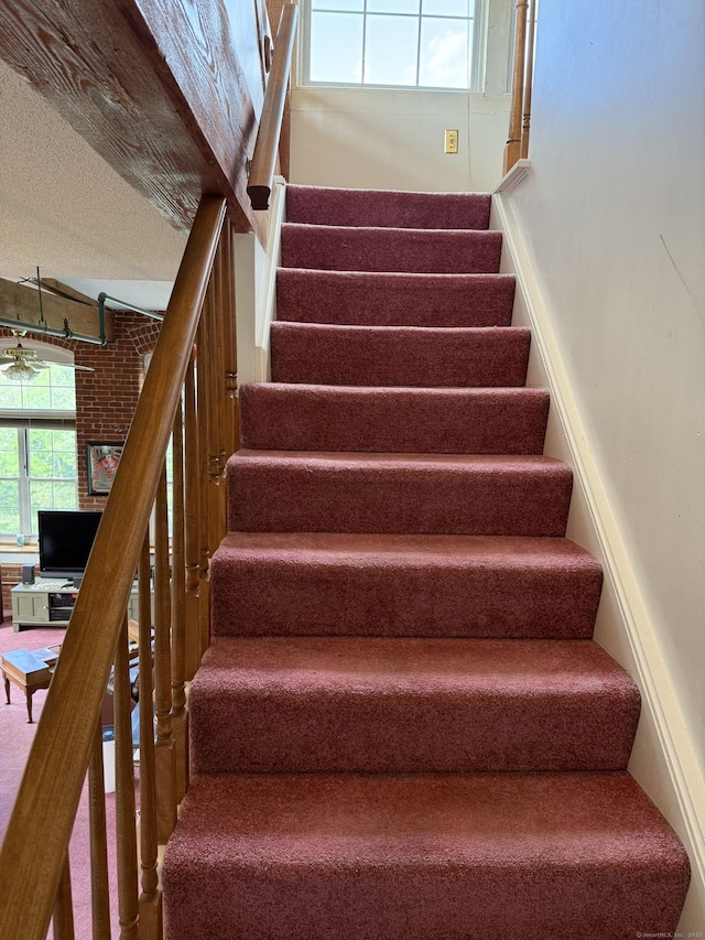 45 Main St Apt 401, Plainfield, CT 06374 - stairway with a textured ceiling and a ceiling fan