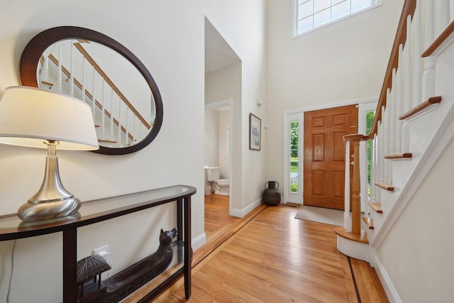 2 Tobins Ct, Danbury, CT 06810 - foyer entrance featuring wood finished floors, a towering ceiling, and stairs