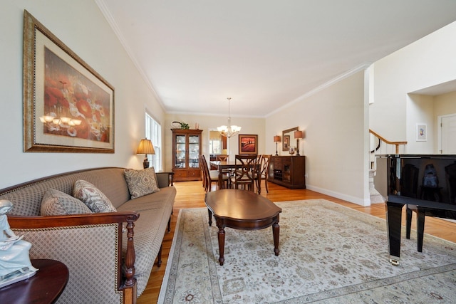 2 Tobins Ct, Danbury, CT 06810 - living area with a chandelier, light wood-style flooring, ornamental molding, and stairway