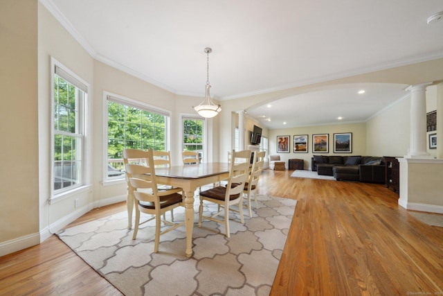 2 Tobins Ct, Danbury, CT 06810 - dining area with decorative columns, arched walkways, light wood-type flooring, crown molding, and recessed lighting