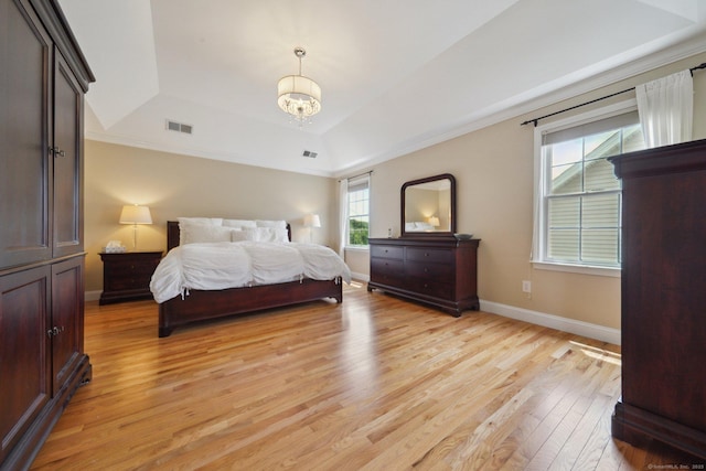 2 Tobins Ct, Danbury, CT 06810 - bedroom featuring a tray ceiling, light wood-style flooring, a chandelier, and ornamental molding