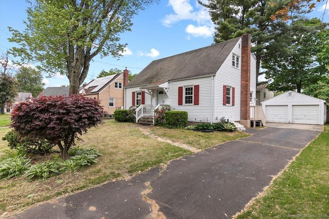 23 Salem Rd, East Hartford, CT 06118 - cape cod house with a chimney, an outdoor structure, a detached garage, a front yard, and roof with shingles