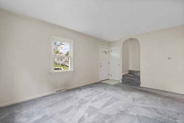 23 Salem Rd, East Hartford, CT 06118 - unfurnished room featuring arched walkways, carpet floors, and baseboards