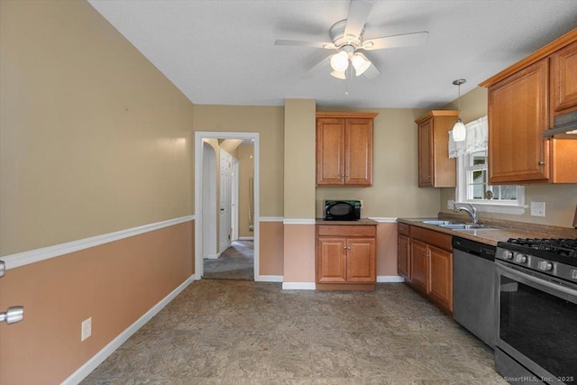23 Salem Rd, East Hartford, CT 06118 - kitchen with stainless steel appliances, a sink, ceiling fan, and brown cabinets