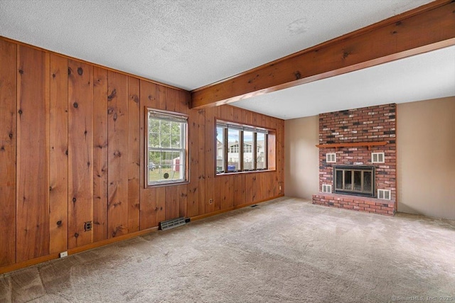 23 Salem Rd, East Hartford, CT 06118 - unfurnished living room featuring carpet floors, wooden walls, beamed ceiling, a textured ceiling, and a fireplace