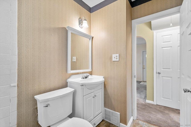 23 Salem Rd, East Hartford, CT 06118 - half bathroom featuring vanity, toilet, baseboards, and wallpapered walls