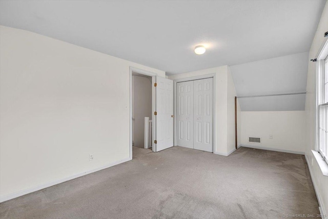 23 Salem Rd, East Hartford, CT 06118 - unfurnished bedroom featuring carpet flooring, baseboards, a closet, and multiple windows