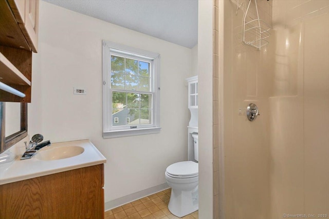 23 Salem Rd, East Hartford, CT 06118 - bathroom with vanity, a shower, toilet, tile patterned flooring, and baseboards
