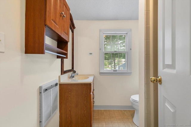 23 Salem Rd, East Hartford, CT 06118 - full bath featuring vanity, heating unit, toilet, and baseboards