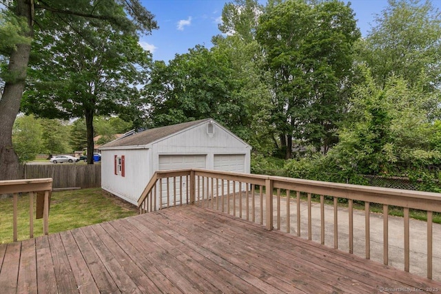 23 Salem Rd, East Hartford, CT 06118 - deck featuring a garage, an outbuilding, a fenced backyard, and view of scattered trees