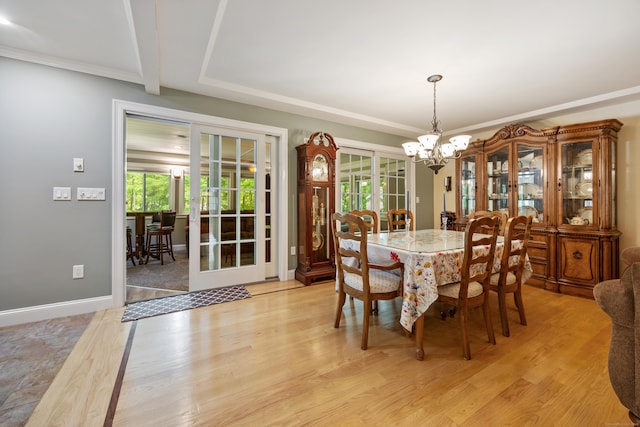 155 Garrigus Ct, Wolcott, CT 06716 - dining space with french doors, a chandelier, and healthy amount of natural light