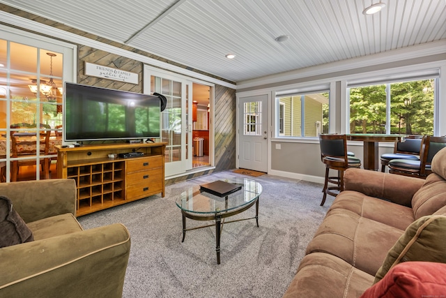 155 Garrigus Ct, Wolcott, CT 06716 - carpeted living room featuring ornamental molding, baseboards, a chandelier, wooden walls, and recessed lighting