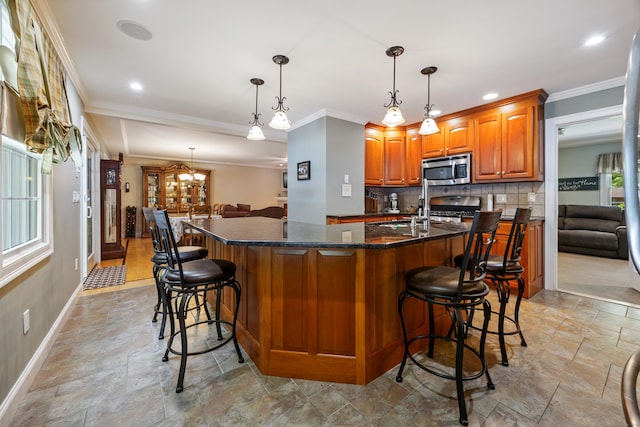 155 Garrigus Ct, Wolcott, CT 06716 - kitchen featuring stainless steel appliances, stone finish floors, brown cabinets, backsplash, and crown molding