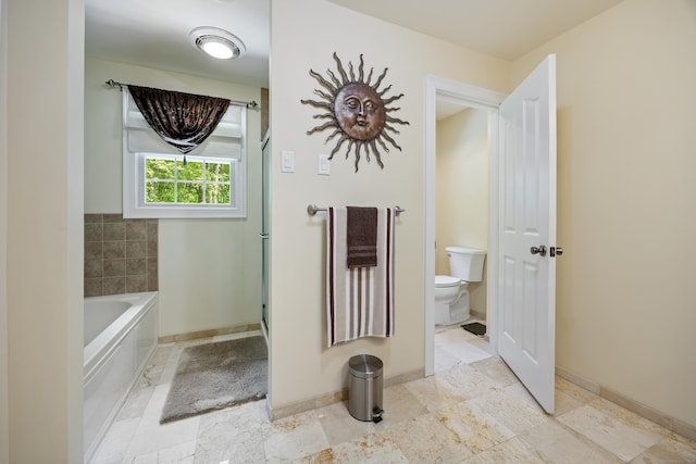 155 Garrigus Ct, Wolcott, CT 06716 - bathroom featuring toilet, a bath, and baseboards