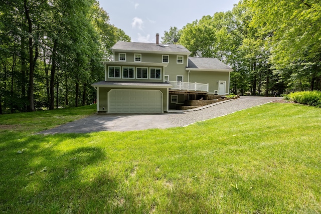 155 Garrigus Ct, Wolcott, CT 06716 - back of house featuring driveway, a garage, a yard, a deck, and a chimney