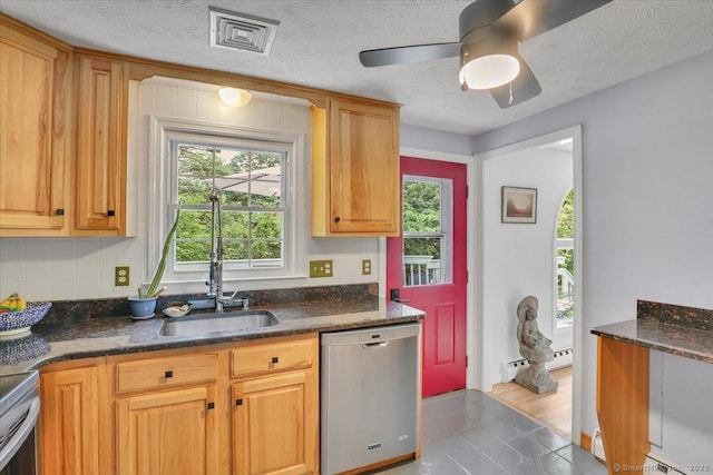 41 Blueberry Cir, Ellington, CT 06029 - kitchen with stainless steel dishwasher, a sink, ceiling fan, tile patterned flooring, and dark stone counters