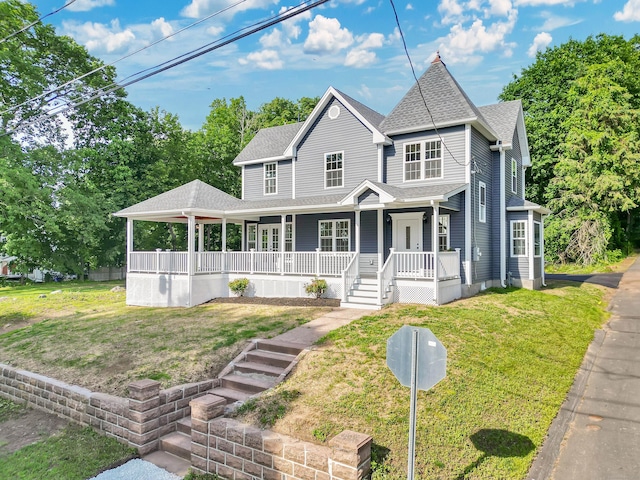 46 N Park St, Ellington, CT 06029 - view of front of home with covered porch, roof with shingles, and a front lawn