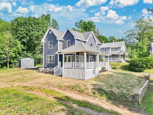 46 N Park St, Ellington, CT 06029 - view of front of house with a front yard, a shingled roof, and a wooden deck