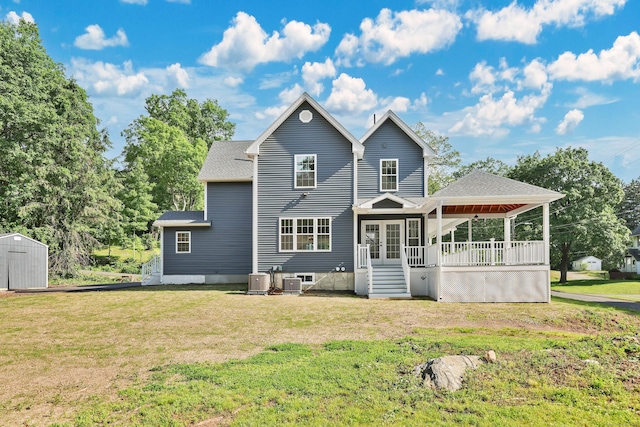 46 N Park St, Ellington, CT 06029 - rear view of house with a yard, french doors, and a shingled roof