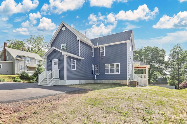 46 N Park St, Ellington, CT 06029 - view of front of home with central AC and a front yard