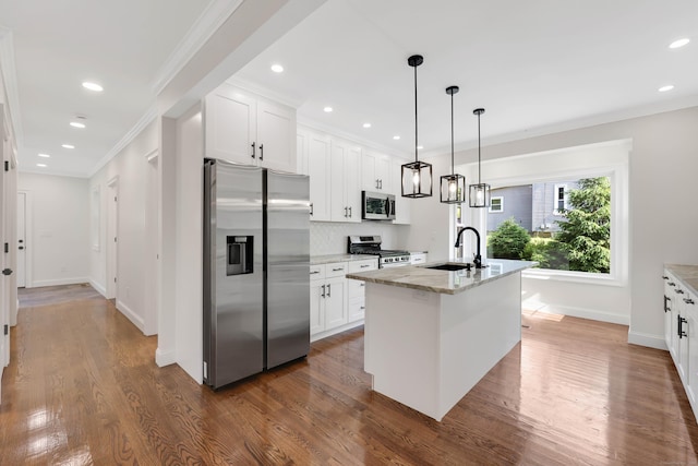 46 N Park St, Ellington, CT 06029 - kitchen featuring appliances with stainless steel finishes, a sink, baseboards, white cabinetry, and crown molding