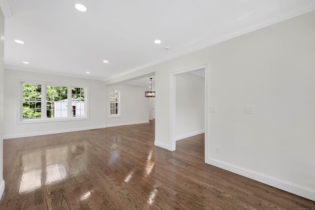 46 N Park St, Ellington, CT 06029 - unfurnished living room featuring crown molding, baseboards, wood finished floors, and recessed lighting