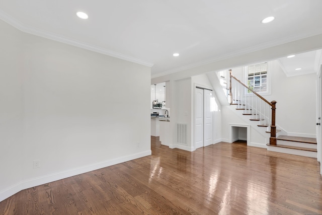 46 N Park St, Ellington, CT 06029 - unfurnished living room featuring stairs, wood finished floors, crown molding, recessed lighting, and baseboards