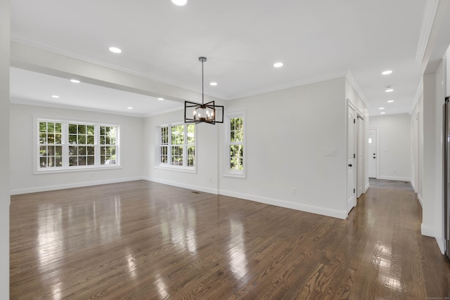 46 N Park St, Ellington, CT 06029 - unfurnished dining area featuring a chandelier, baseboards, dark wood-type flooring, crown molding, and recessed lighting