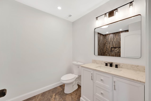 46 N Park St, Ellington, CT 06029 - bathroom featuring baseboards, vanity, and toilet